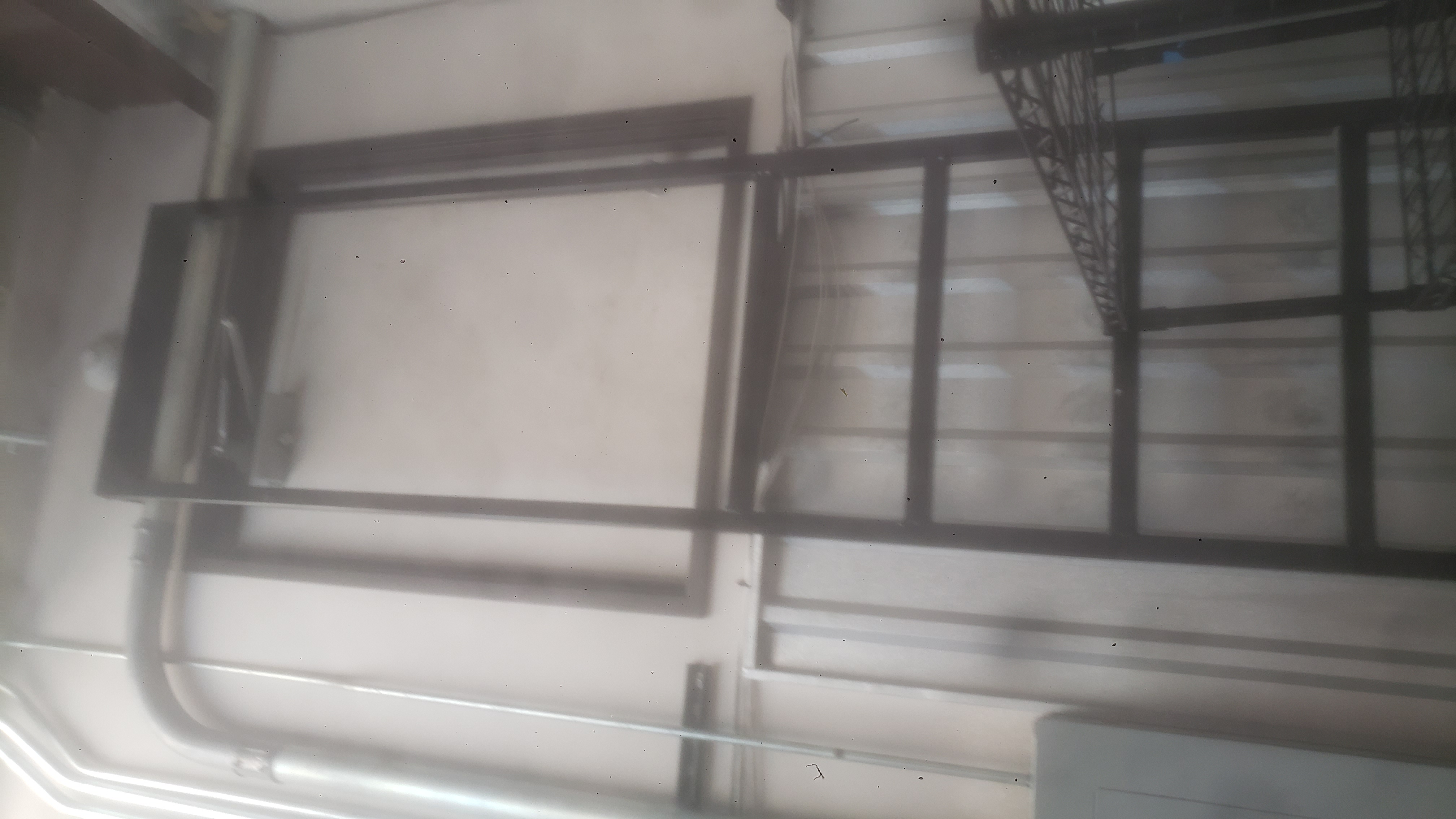 Upper door with a metal ladder.